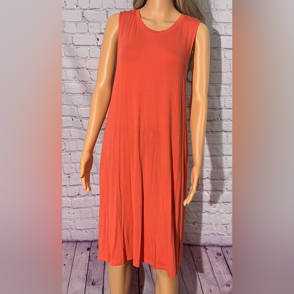 Women’s orange loose fitting casual sundress with pockets